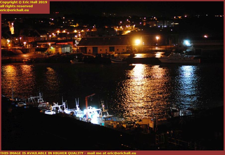 night fishing boat unloading port de granville harbour manche normandy france