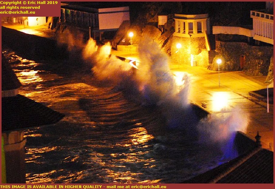 night stom waves breaking over sea wall plat gousset granville manche normandy france