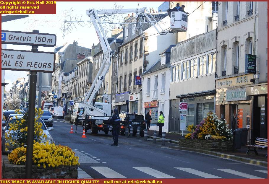 erecting christmas lights rue couraye granville manche normandy france