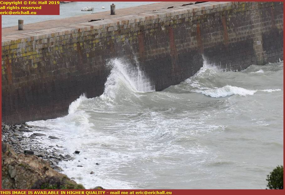 storm high winds waves sea wall port de granville harbour manche normandy france