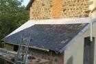 slating tiling lean to roof aspire recycled plastic slate tile les guis virlet puy de dome france stand alone renewable energy farm solar panels wind turbines copyright free photo royalty free photo
