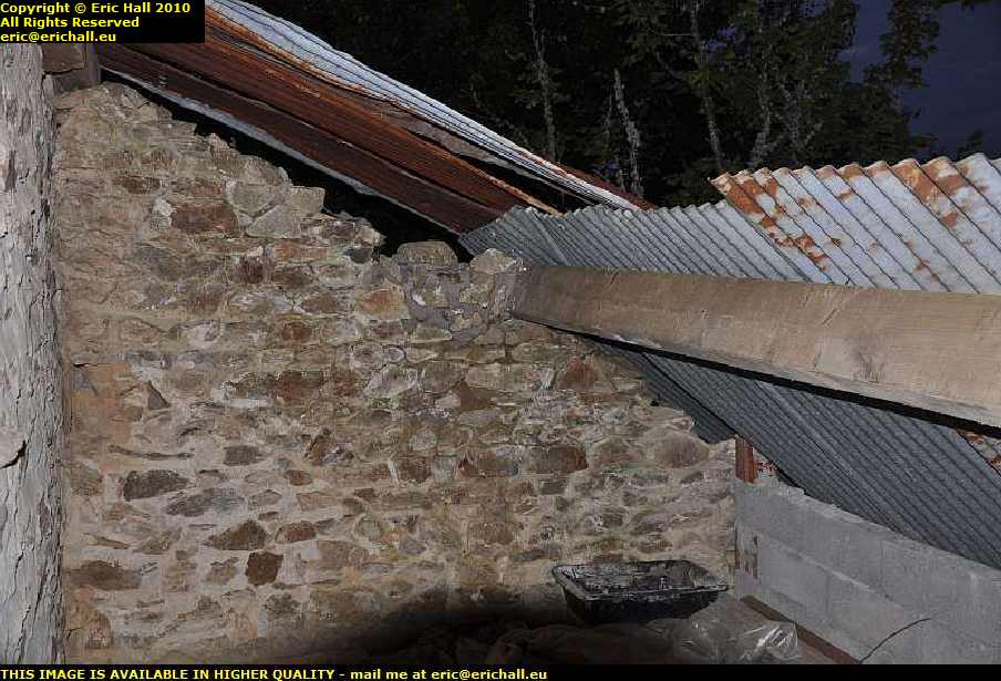 rebuilding stone wall collapsed lean to les guis virlet puy de dome france